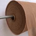 Roll of brown kraft paper on a metal spool, partially unrolled. This durable paper is ideal for packaging, crafts, and artistic projects.