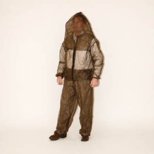 Man standing in a translucent brown protective suit with a hood. The outfit is designed for insect protection, highlighting safety gear for outdoor activities.